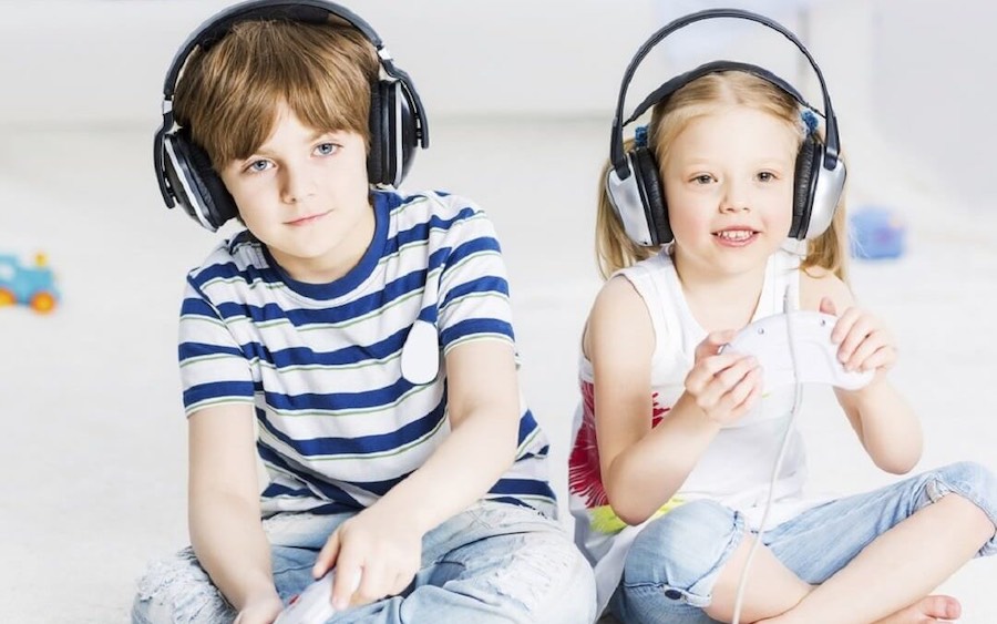 Cute Boy And Girl Playing Video Games