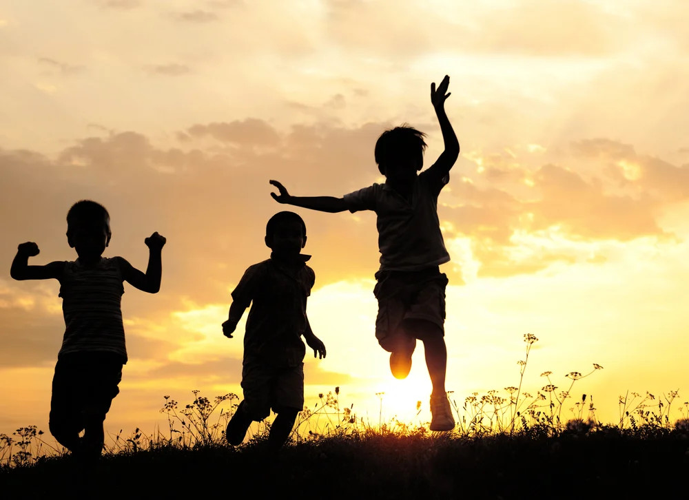 Children Running On Meadow At Sunset 1