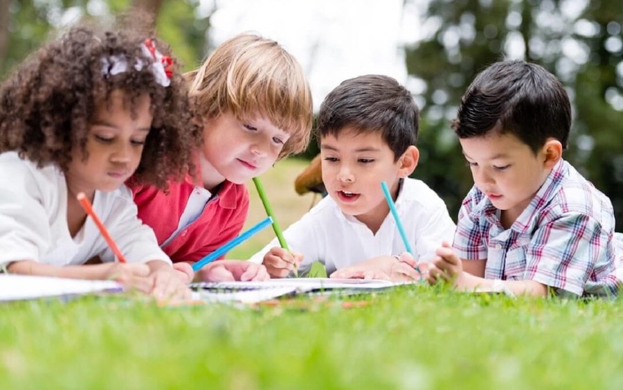 Group Of School Kids Practicing Fine Motor Skills