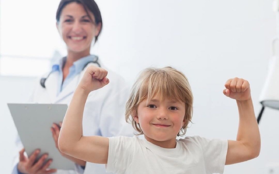 Happy Child Next To A Doctor