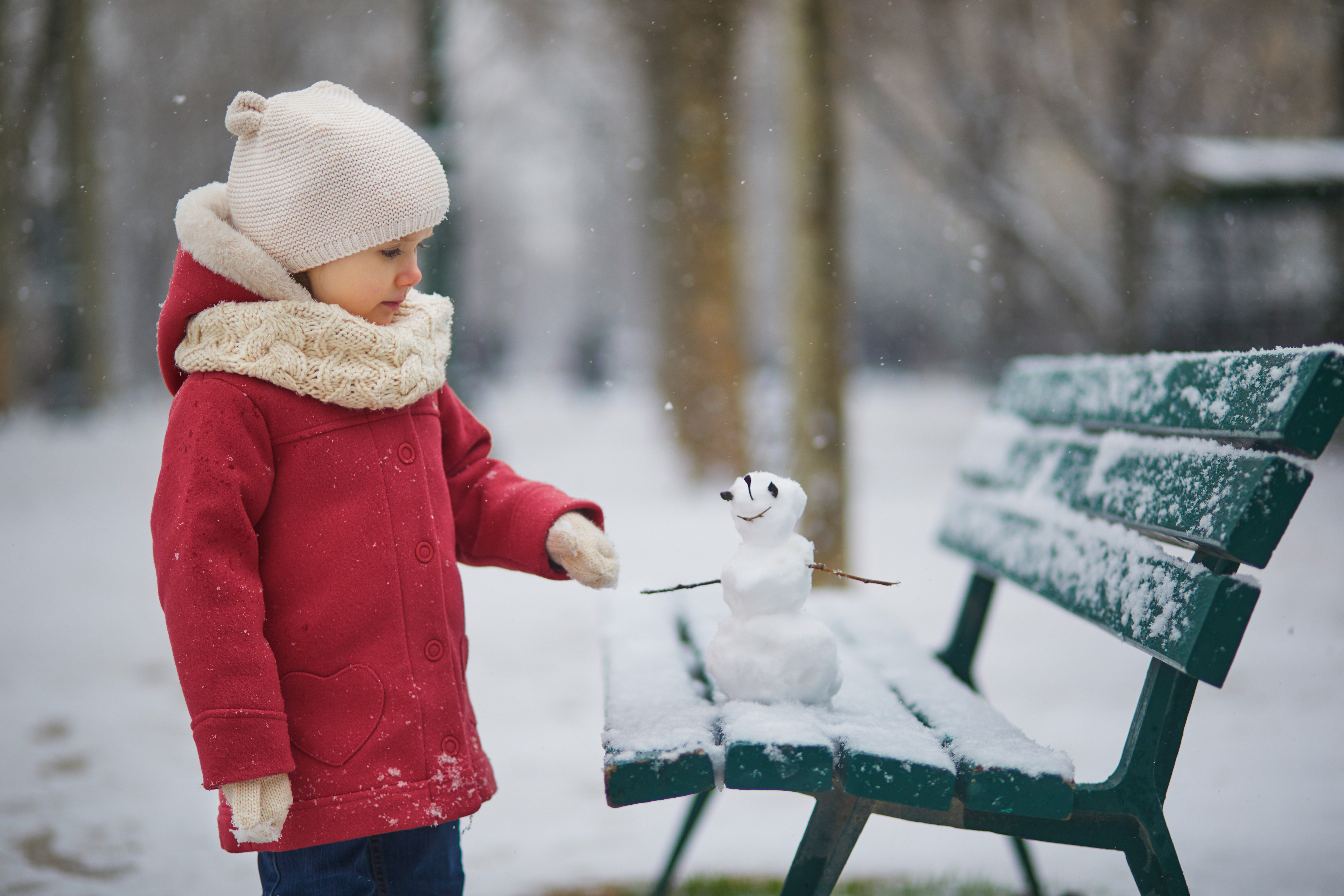 Girl With Small Snowman