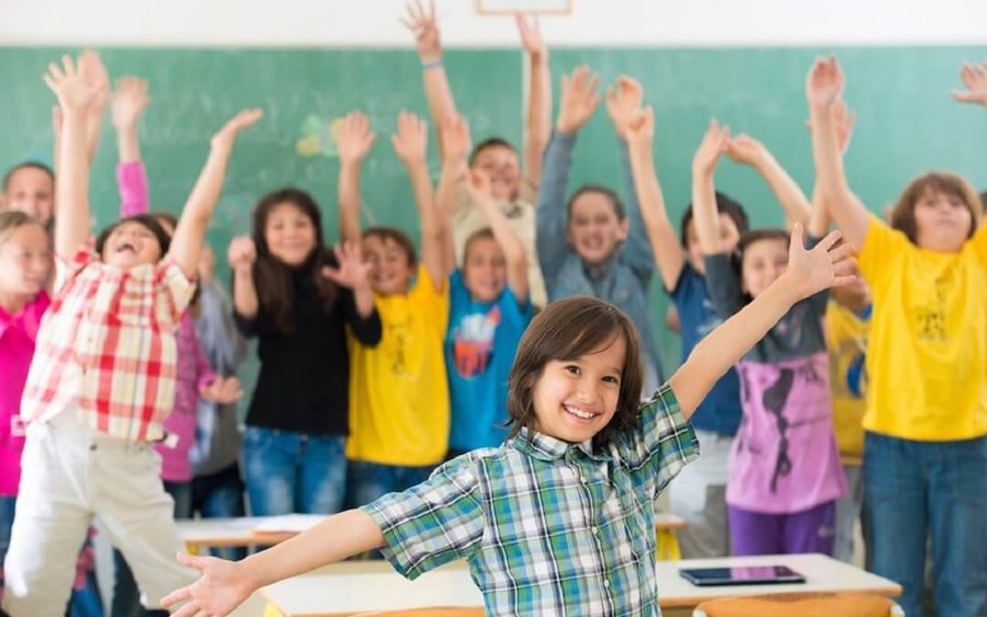 1Group Of Kids Having Up Rising Hands With Books In Classroom 1080X675